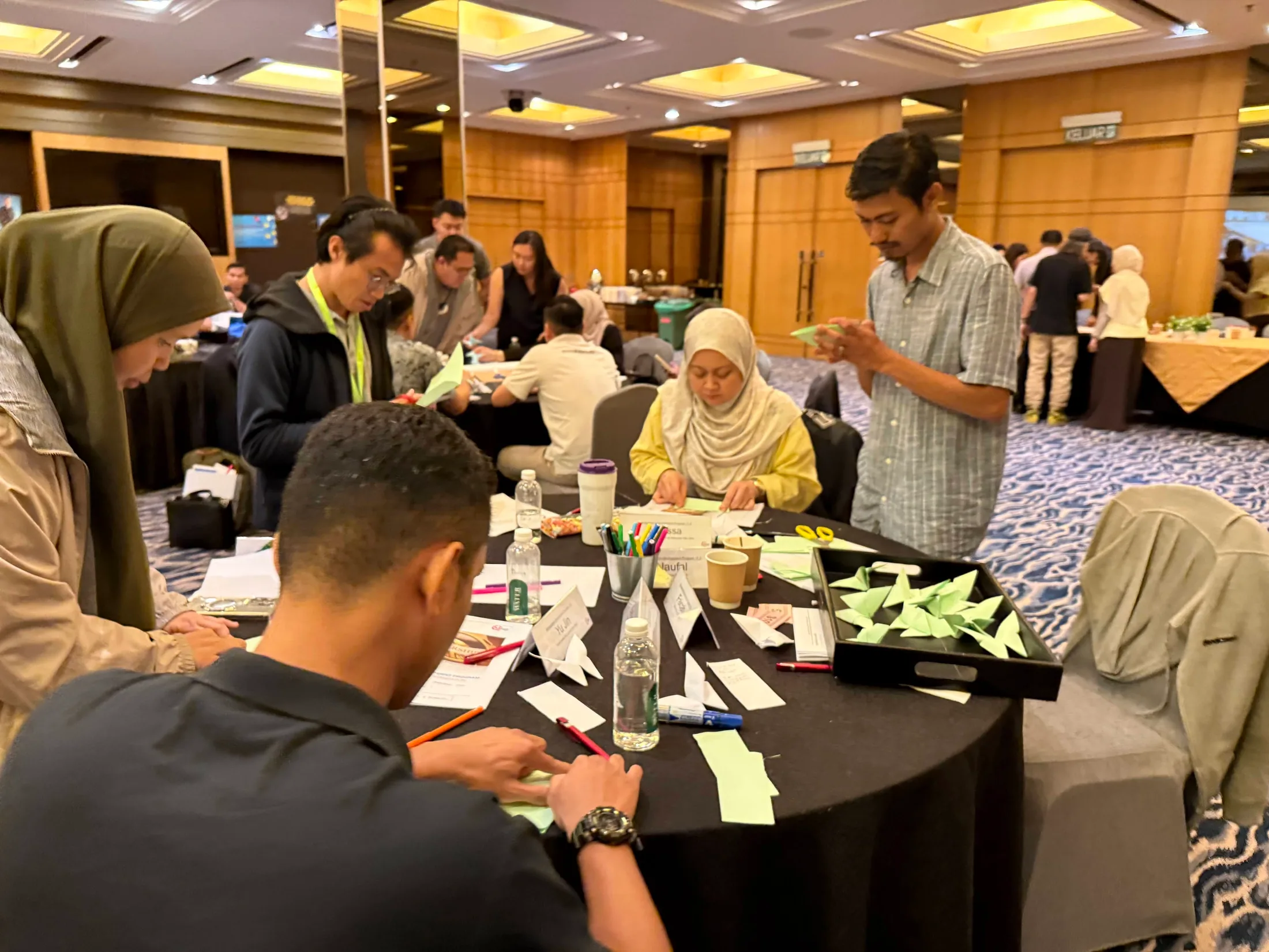 MDP participants completing a hands-on workshop exercise at a table
